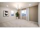 Open bonus room with neutral colors, natural light, and stylish chandelier at 13195 N 145Th Ln, Surprise, AZ 85379