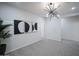 Bonus room with stylish light fixture, wall art, and neutral carpet at 13195 N 145Th Ln, Surprise, AZ 85379