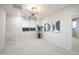 Bonus room filled with natural light, stylish light fixture and neutral colored carpet at 13195 N 145Th Ln, Surprise, AZ 85379