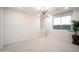 Bonus room with modern light fixture and a large window with neighborhood views at 13195 N 145Th Ln, Surprise, AZ 85379