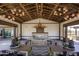 Inviting community clubhouse with stylish lighting, comfortable seating, and a cozy fireplace for relaxation and entertainment at 13195 N 145Th Ln, Surprise, AZ 85379