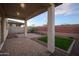 Covered patio with brick pavers, artificial turf, and view of the brick and block wall at 13195 N 145Th Ln, Surprise, AZ 85379