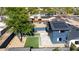 Backyard aerial view featuring artificial turf, trees, and a detached garage in a fenced-in area at 1338 E Granada Rd, Phoenix, AZ 85006