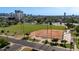 Aerial view showcasing a park, ball field, palm trees, and the cityscape in the background at 1338 E Granada Rd, Phoenix, AZ 85006