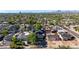 Scenic view of the neighborhood showcasing lush trees, varied rooflines, and distant mountains at 1338 E Granada Rd, Phoenix, AZ 85006
