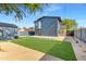 An expansive backyard features turf, xeriscaping, and a converted garage enhancing outdoor enjoyment at 1338 E Granada Rd, Phoenix, AZ 85006