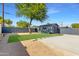 A spacious backyard blends xeriscaping, turf, and hardscape leading to a converted garage at 1338 E Granada Rd, Phoenix, AZ 85006