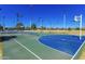 Well-maintained basketball court with vibrant blue and green surfaces, perfect for sports enthusiasts at 1338 E Granada Rd, Phoenix, AZ 85006