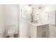 Powder room featuring floating vanity with vessel sink, modern light fixtures and fixtures at 1338 E Granada Rd, Phoenix, AZ 85006