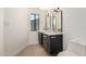 Bathroom featuring dual sinks with marble countertops and gold hardware at 1338 E Granada Rd, Phoenix, AZ 85006