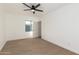 Bedroom with neutral tones, ceiling fan and view out window at 1338 E Granada Rd, Phoenix, AZ 85006
