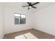 Bright bedroom with a ceiling fan, a large window, and wood flooring at 1338 E Granada Rd, Phoenix, AZ 85006