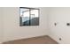 Unfurnished room with wood flooring, a window and utility connections at 1338 E Granada Rd, Phoenix, AZ 85006