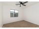Bedroom with neutral tones, ceiling fan and a window at 1338 E Granada Rd, Phoenix, AZ 85006