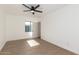 Well-lit bedroom with a modern ceiling fan and luxury vinyl plank flooring at 1338 E Granada Rd, Phoenix, AZ 85006