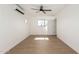 Bright, empty bedroom with new vinyl plank flooring, modern ceiling fan, and fresh white paint at 1338 E Granada Rd, Phoenix, AZ 85006