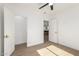 Bright room with wood flooring, two entry doors and a view into the kitchen at 1338 E Granada Rd, Phoenix, AZ 85006