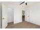 Bright bedroom showcasing neutral tones and open doorways at 1338 E Granada Rd, Phoenix, AZ 85006