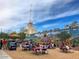 A busy downtown park featuring a mural and many people enjoying a sunny afternoon at 1338 E Granada Rd, Phoenix, AZ 85006