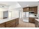 Kitchen view featuring a large island with seating, shaker cabinets, and stainless steel appliances at 1338 E Granada Rd, Phoenix, AZ 85006