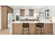 Modern kitchen with quartz countertops, stainless steel appliances, and wood cabinets at 1338 E Granada Rd, Phoenix, AZ 85006