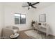 Bright office space with modern fan, sleek desk, chair, and comfortable seating area at 1338 E Granada Rd, Phoenix, AZ 85006