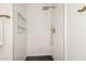Stylish shower with white subway tile, a built-in niche, and gold fixtures at 1338 E Granada Rd, Phoenix, AZ 85006