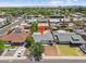 Aerial view of a neighborhood, highlighting a home with proximity to local amenities and schools at 1367 E Mitchell Dr, Phoenix, AZ 85014