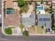 Aerial view of a home with a well-kept backyard, complemented by mature trees and landscaping at 1367 E Mitchell Dr, Phoenix, AZ 85014