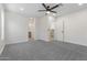 Spacious bedroom with modern ceiling fan, neutral carpet, and lots of natural light at 1367 E Mitchell Dr, Phoenix, AZ 85014