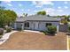 Charming single-story home featuring desert landscaping, a modern front door, and a gray paint scheme at 1367 E Mitchell Dr, Phoenix, AZ 85014