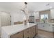Spacious kitchen island with drawers and cabinets, and a modern light fixture at 1367 E Mitchell Dr, Phoenix, AZ 85014