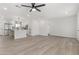 Spacious living area with wood floors offering seamless transition to the kitchen and other parts of the home at 1367 E Mitchell Dr, Phoenix, AZ 85014