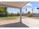 Inviting covered patio overlooking a spacious backyard, perfect for outdoor gatherings and relaxation at 1367 E Mitchell Dr, Phoenix, AZ 85014