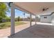 Well-designed covered patio with ceiling fan, providing a comfortable space for outdoor living and entertaining at 1367 E Mitchell Dr, Phoenix, AZ 85014