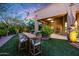 Spacious backyard with artificial grass and outdoor dining area for entertaining and relaxation at 14598 E Corrine Dr, Scottsdale, AZ 85259