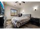 A stylish bedroom showcasing a ceiling fan, natural light from a window, and complementing furniture at 14598 E Corrine Dr, Scottsdale, AZ 85259