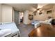 Spacious bedroom with multiple beds, a barn door to another room, and soft carpet flooring at 14598 E Corrine Dr, Scottsdale, AZ 85259