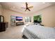 Large primary bedroom featuring a ceiling fan, lounge chair and exterior access at 14598 E Corrine Dr, Scottsdale, AZ 85259
