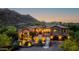 Inviting exterior elevation with meticulously landscaped yard and illuminated by strategically placed outdoor lighting at 14598 E Corrine Dr, Scottsdale, AZ 85259