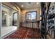 Charming foyer with beautiful rugs, a cozy window seat, and an arched doorway, creating a welcoming and elegant entrance at 14598 E Corrine Dr, Scottsdale, AZ 85259