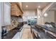 Modern kitchen with granite counters, stainless appliances, and large basin sink at 14598 E Corrine Dr, Scottsdale, AZ 85259