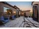 Cozy patio with comfortable seating, complemented by stylish decor and wrought iron doors providing seamless indoor-outdoor living at 14598 E Corrine Dr, Scottsdale, AZ 85259