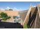 This backyard has gravel, budding plants and trees, and a wall at 16251 N 91St Dr, Peoria, AZ 85382