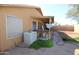This backyard features an air conditioning unit, a covered patio, and gravel ground cover at 16251 N 91St Dr, Peoria, AZ 85382