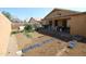 This backyard features dirt, a partially covered patio, and partial growth at 16251 N 91St Dr, Peoria, AZ 85382