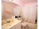 Cozy primary bathroom with a single sink vanity and shower-tub combo at 16251 N 91St Dr, Peoria, AZ 85382