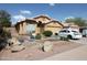 Charming single-Gathering home with desert landscaping and a two-car garage at 16251 N 91St Dr, Peoria, AZ 85382