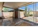 Desert backyard featuring cacti, trees, covered patio, and decorative gravel at 1808 W Rose Ln, Phoenix, AZ 85015