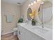 Bathroom featuring double sinks, modern fixtures, and plenty of counter space at 1808 W Rose Ln, Phoenix, AZ 85015